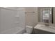 Bright bathroom featuring a tub-shower combo and a modern vanity at 326 Umstead St, Sanford, NC 27330