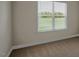 Simple bedroom with tan carpeting and bright, natural light from the large window at 326 Umstead St, Sanford, NC 27330