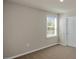 Bedroom with neutral carpet, one window, and a smooth wall finish at 326 Umstead St, Sanford, NC 27330