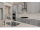 Sleek kitchen with gray cabinetry, stainless steel appliances, and stylish countertops at 326 Umstead St, Sanford, NC 27330