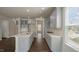 New open concept kitchen features a center island with a sink and stainless steel appliances and grey cabinets at 326 Umstead St, Sanford, NC 27330