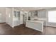 This new, bright kitchen has an island, stainless steel appliances and hardware, and lots of storage space at 326 Umstead St, Sanford, NC 27330