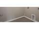 Laundry room with wood-look tile and neutral paint at 326 Umstead St, Sanford, NC 27330