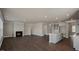 Open concept with a fireplace and lots of light from many windows in a living room with hardwood floors at 326 Umstead St, Sanford, NC 27330