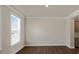 Bright living room with hardwood floors and elegant trim at 326 Umstead St, Sanford, NC 27330