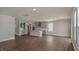 This new living room is open to the kitchen, features hardwood floors, and has lots of light at 326 Umstead St, Sanford, NC 27330