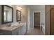 Main bathroom with double vanity, tiled floor and shower at 326 Umstead St, Sanford, NC 27330