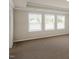 Spacious main bedroom with carpet and natural light from large windows at 326 Umstead St, Sanford, NC 27330