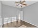 Bedroom with wood-look floors, neutral walls, and a ceiling fan at 3408 Dutchman Rd, Raleigh, NC 27610