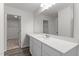 Bright bathroom with a large mirror, white cabinets, and a walk-in closet at 40 Rolling Banks Dr, Louisburg, NC 27549