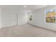 Bedroom featuring carpeted floors, white walls, and natural light at 40 Rolling Banks Dr, Louisburg, NC 27549