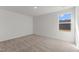 Bedroom featuring a large window and neutral carpet at 40 Rolling Banks Dr, Louisburg, NC 27549