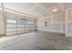Spacious two-car garage with a concrete floor and an insulated garage door at 40 Rolling Banks Dr, Louisburg, NC 27549
