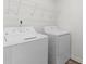 Laundry room featuring new appliances and wire rack shelving at 40 Rolling Banks Dr, Louisburg, NC 27549