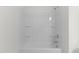 Shower-tub combo with shower head and built-in shelving at 40 Rolling Banks Dr, Louisburg, NC 27549