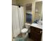 Clean bathroom featuring a shower with curtain, wood vanity and tile flooring at 421 Angus Pl, Stem, NC 27581