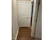 Hallway with hardwood floors and doors leading to other rooms at 421 Angus Pl, Stem, NC 27581