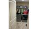 Practical laundry room with a washer, dryer, and ample storage space at 421 Angus Pl, Stem, NC 27581