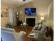 Cozy living room featuring a fireplace, hardwood floors, and stylish decor at 421 Angus Pl, Stem, NC 27581