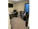 Functional home office setup with a desk, chair, and modern computer equipment at 421 Angus Pl, Stem, NC 27581