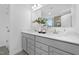 Elegant bathroom featuring double sinks, quartz countertops, modern fixtures, and a bright, airy feel at 43 Mable Court # 4, Lillington, NC 27546