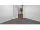 Inviting bedroom with wood-look floors and a view of the staircase through the french doors at 43 Mable Court # 4, Lillington, NC 27546