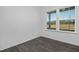 Bright bedroom features wood-look flooring and a view of the outdoors through a large window at 43 Mable Court # 4, Lillington, NC 27546