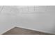 Walk-in closet features white wire shelving and neutral carpeting for optimal storage and organization at 43 Mable Court # 4, Lillington, NC 27546