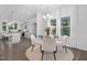 Stylish dining area adjacent to the kitchen, featuring a round glass table and elegant chandelier at 43 Mable Court # 4, Lillington, NC 27546