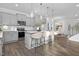 Modern kitchen with sleek gray cabinets, stainless steel appliances, and a spacious island with bar seating at 43 Mable Court # 4, Lillington, NC 27546