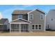 Rear exterior of a two-story home with a screened porch and gray siding at 43 Mable Court # 4, Lillington, NC 27546