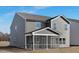 Exterior angle of a two-story home featuring gray vinyl siding and a screened porch at 43 Mable Court # 4, Lillington, NC 27546