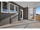 This screened porch has a fan, a door leading inside the home, and several windows at 43 Mable Court # 4, Lillington, NC 27546