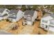 Aerial view of a well-maintained neighborhood with similar style homes, driveways and landscaping at 532 Smithridge Way, Fuquay Varina, NC 27526
