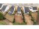 Aerial view of a landscaped backyard with a pond and patio, enhancing the outdoor living space of the home at 532 Smithridge Way, Fuquay Varina, NC 27526