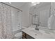 This bathroom features a shower/tub combo with a toilet, vanity, and a decorative mirror providing functionality at 532 Smithridge Way, Fuquay Varina, NC 27526