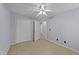 This is a spacious bedroom with a ceiling fan, carpet flooring and a double door closet for ample storage at 532 Smithridge Way, Fuquay Varina, NC 27526