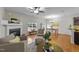 Bright dining area featuring hardwood floors, large windows, and a stylish chandelier at 532 Smithridge Way, Fuquay Varina, NC 27526