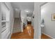 Welcoming entryway with hardwood floors, staircase, and convenient powder room access at 532 Smithridge Way, Fuquay Varina, NC 27526