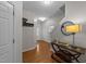 Inviting foyer with hardwood floors, stylish console table, and a coat rack for added convenience at 532 Smithridge Way, Fuquay Varina, NC 27526