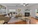 Comfortable living room with fireplace, ceiling fan, and warm, inviting atmosphere at 532 Smithridge Way, Fuquay Varina, NC 27526