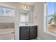Bathroom features dark vanity, white countertop, and a large mirror at 594 Executive Dr, Lillington, NC 27546
