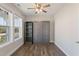 Cozy bedroom featuring a Murphy bed, a bookcase, and natural light from the window at 594 Executive Dr, Lillington, NC 27546