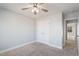 Neutral bedroom features carpet flooring, ceiling fan, and a closet with double doors at 594 Executive Dr, Lillington, NC 27546