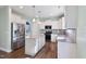 Modern kitchen featuring white cabinets, a center island, and stainless steel appliances at 594 Executive Dr, Lillington, NC 27546