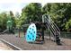 Community playground with climbing structures, slide, and safety ground cover at 594 Executive Dr, Lillington, NC 27546