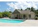 Community pool and clubhouse, ideal for relaxation and social gatherings at 594 Executive Dr, Lillington, NC 27546