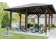 Poolside gazebo with picnic tables and BBQ, offering a delightful outdoor space at 594 Executive Dr, Lillington, NC 27546