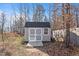 Utility shed with double doors and a wood ramp at 594 Executive Dr, Lillington, NC 27546