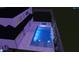Rendering of backyard pool with spa, LED bubblers, and surrounding landscape at night at 6844 Greystone Dr, Raleigh, NC 27615